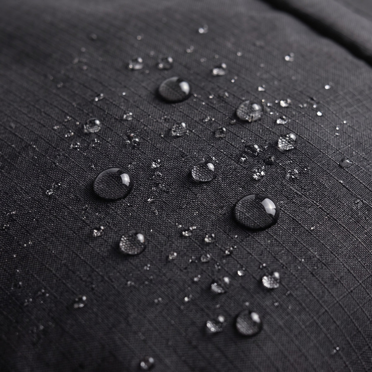 Water beading on the ALVA's black ripstop shell