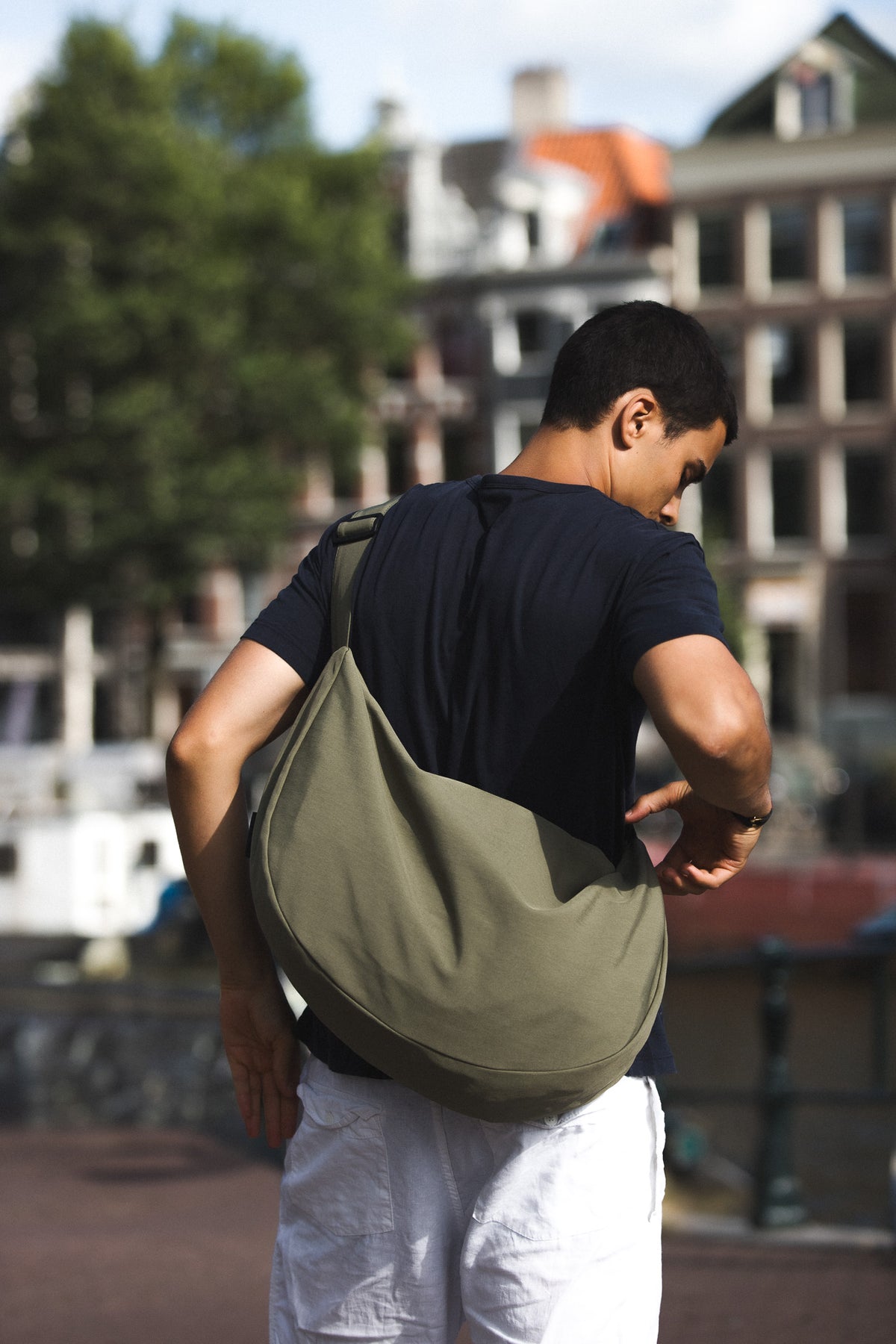 The SIV worn across the back on its adjustable strap, on an Amsterdam canal
