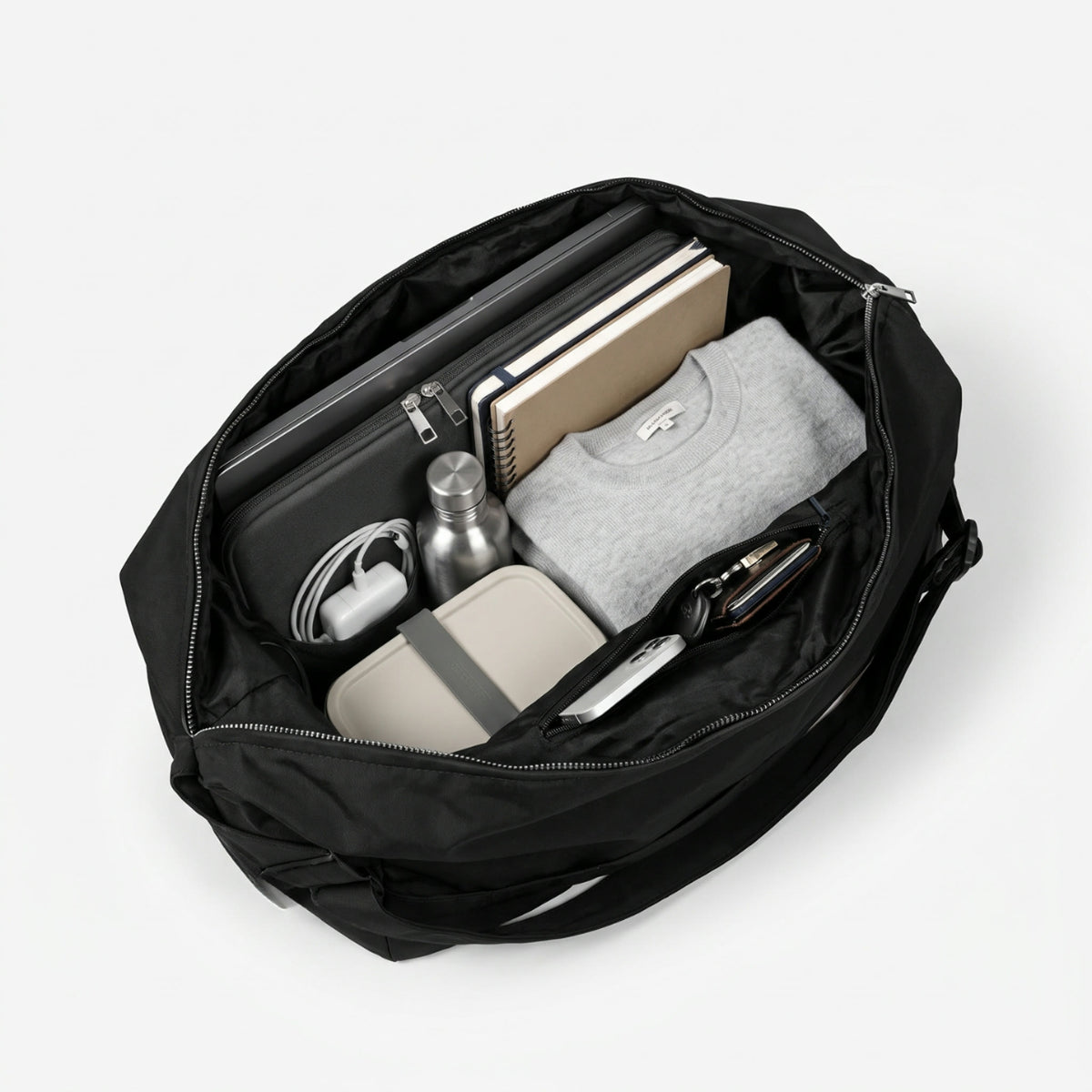 The SIV packed with a laptop, notebooks, a bottle, lunch and a sweater